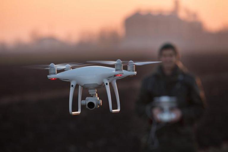 man flying drone