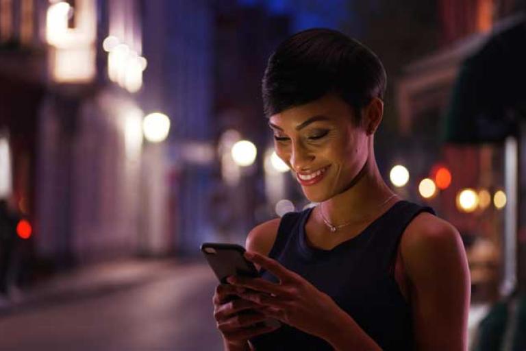 woman exploring financial services with phone